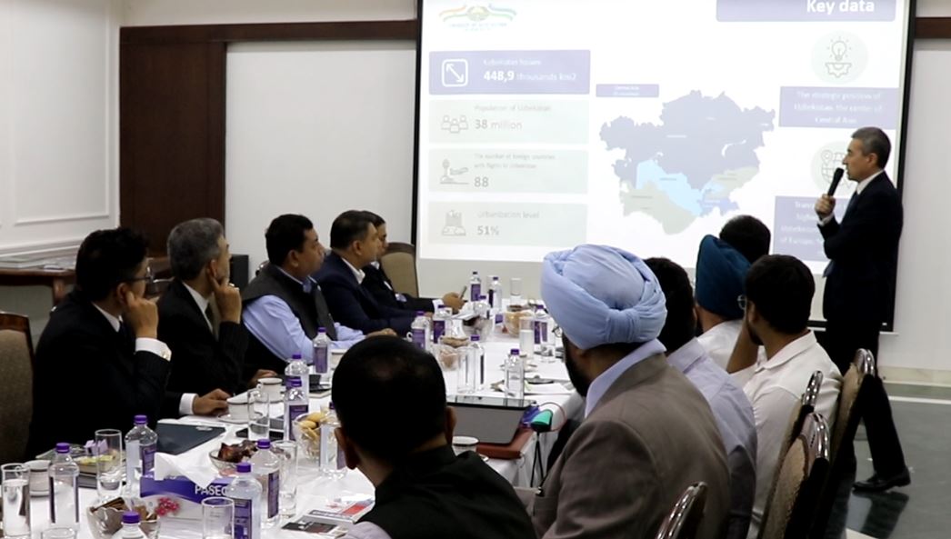 Uzbekistan Tech and Trade movement — a presentation featuring a map of Uzbekistan during a business discussion.