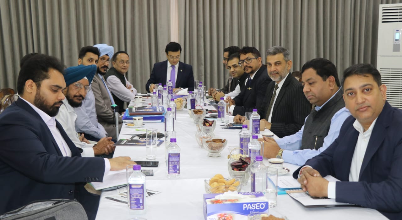Uzbekistan Tech and Trade movement — participants seated around a conference table during a working discussion in India.